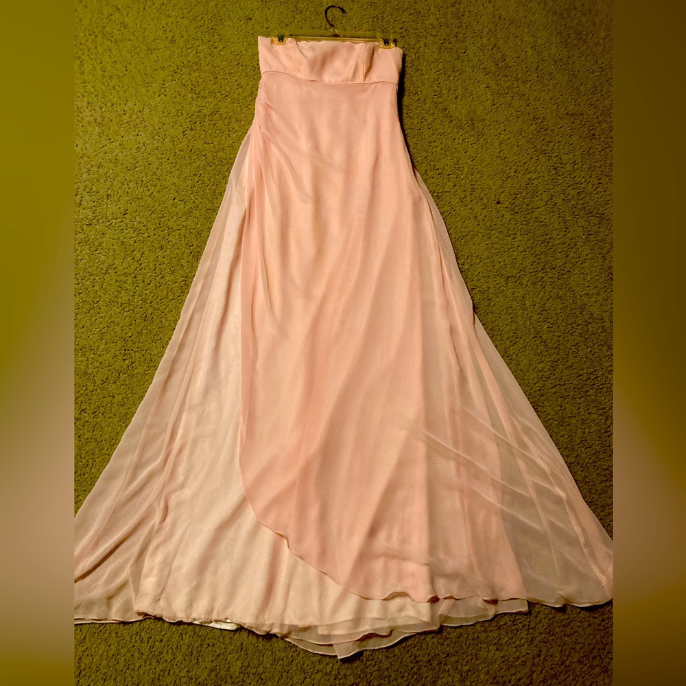 A strapless formal pastel pink gown.